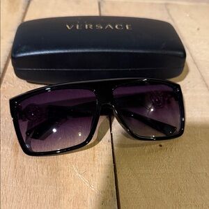 Versace Sunglasses with Black Frames and Purple Lenses